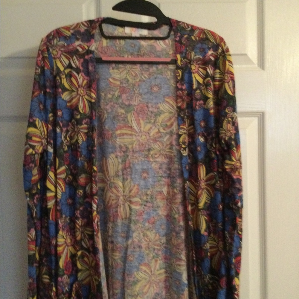 Like New Lularoe Sarah Sweater in Medium with floral pattern in blue, yellow